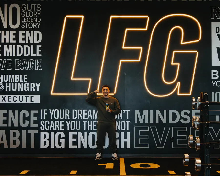 Eric in front of the LFG wall at the C4 Performance Center